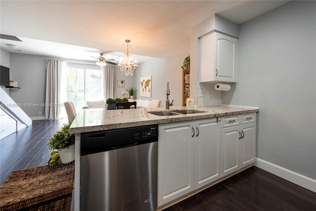 1606 Veracruz Ln, Weston, FL 33327 - kitchen with stainless steel dishwasher, a chandelier, a peninsula, and dark wood-style floors