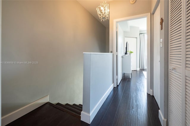 1606 Veracruz Ln, Weston, FL 33327 - hallway with a chandelier, dark wood-type flooring, and an upstairs landing