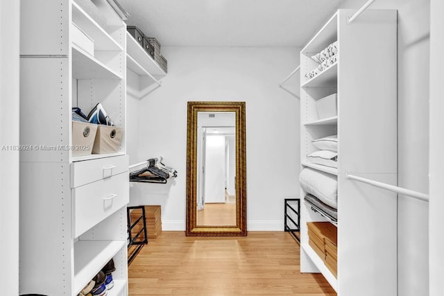 8855 E Collins Ave Unit 2F, Surfside, FL 33154 - spacious closet with light wood-style flooring
