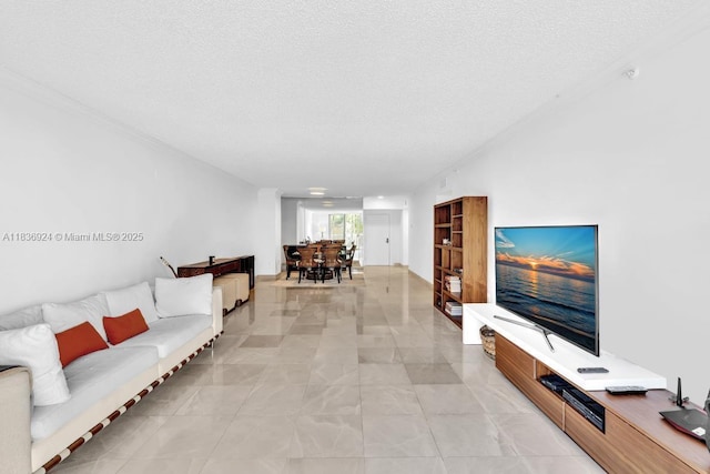 8855 E Collins Ave Unit 2F, Surfside, FL 33154 - living area with a textured ceiling and light marble finish flooring