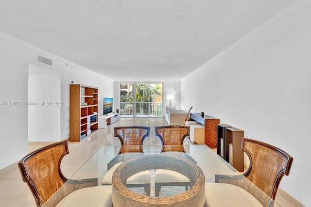 8855 E Collins Ave Unit 2F, Surfside, FL 33154 - dining space featuring crown molding, tile patterned flooring, and a textured ceiling