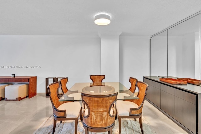 8855 E Collins Ave Unit 2F, Surfside, FL 33154 - dining room featuring ornamental molding