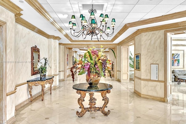 8855 E Collins Ave Unit 2F, Surfside, FL 33154 - corridor featuring ornamental molding, a chandelier, and a tray ceiling