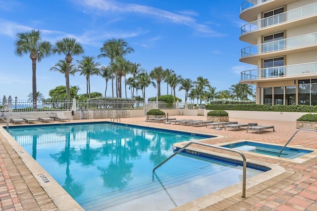 8855 E Collins Ave Unit 2F, Surfside, FL 33154 - community pool with a patio area and a community hot tub