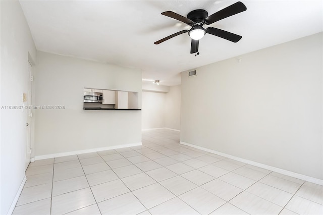 12136 Saint Andrews Pl Unit 204, Miramar, FL 33025 - spare room with a ceiling fan and light tile patterned flooring