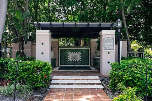 12136 Saint Andrews Pl Unit 204, Miramar, FL 33025 - view of exterior entry with stucco siding