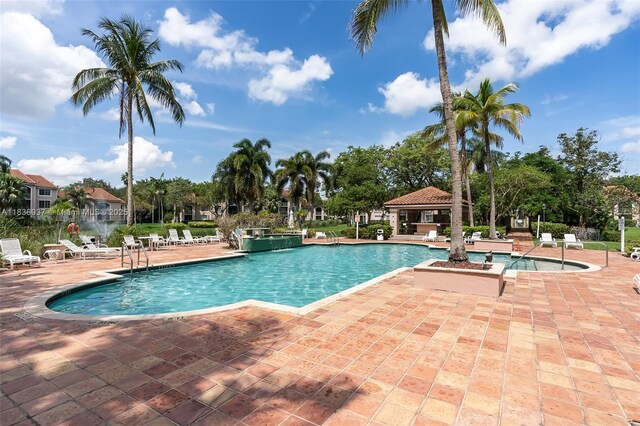 12136 Saint Andrews Pl Unit 204, Miramar, FL 33025 - community pool featuring a patio area
