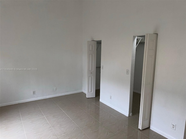5201 SW 31st Ave Unit 112, Dania Beach, FL 33312 - tiled empty room featuring baseboards
