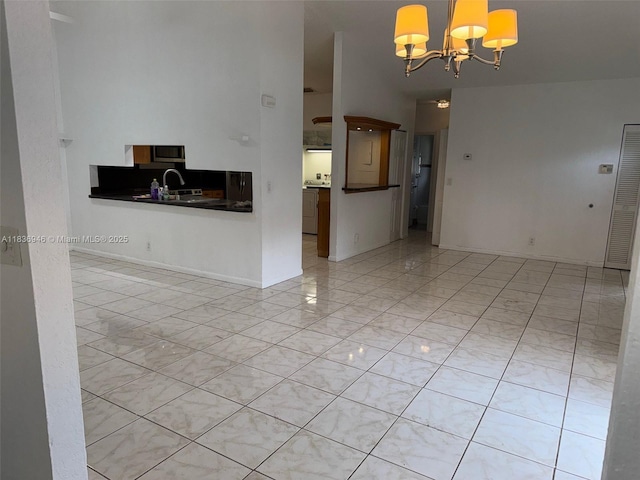 5201 SW 31st Ave Unit 112, Dania Beach, FL 33312 - unfurnished living room with a chandelier and light tile patterned floors