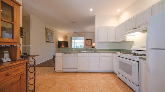 12303 Hollybush Ter, Bradenton, FL 34202 - kitchen featuring white appliances, under cabinet range hood, white cabinets, and recessed lighting