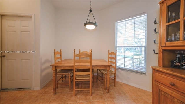 12303 Hollybush Ter, Bradenton, FL 34202 - dining space with baseboards and light tile patterned flooring