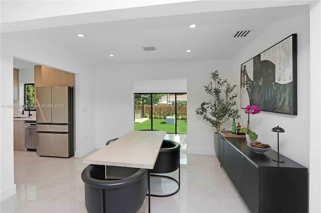 231 NE 45th St, Miami, FL 33137 - dining room featuring recessed lighting and light tile patterned floors