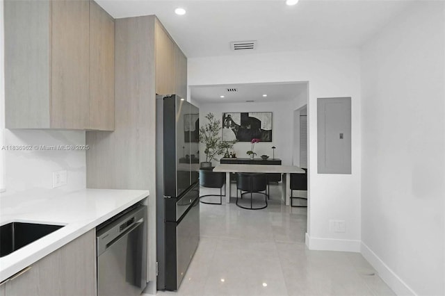 231 NE 45th St, Miami, FL 33137 - kitchen featuring dishwasher, modern cabinets, freestanding refrigerator, light brown cabinetry, and light countertops