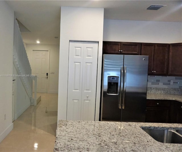 10498 W 33rd Way, Hialeah, FL 33018 - kitchen featuring stainless steel refrigerator with ice dispenser, dark brown cabinetry, light stone counters, recessed lighting, and backsplash