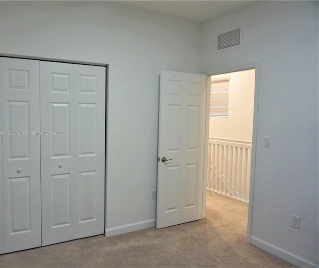 10498 W 33rd Way, Hialeah, FL 33018 - unfurnished bedroom with light colored carpet and a closet