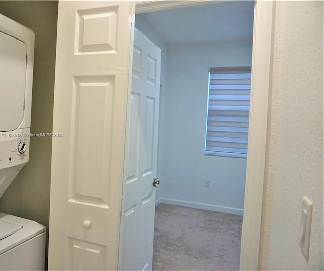 10498 W 33rd Way, Hialeah, FL 33018 - washroom featuring stacked washer / drying machine and carpet