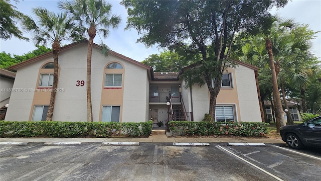 9277 SW 138th Pl Unit 9277, Miami, FL 33186 - view of building exterior featuring uncovered parking and stairway
