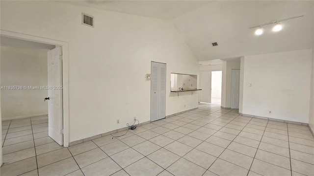 9277 SW 138th Pl Unit 9277, Miami, FL 33186 - spare room with light tile patterned flooring and high vaulted ceiling