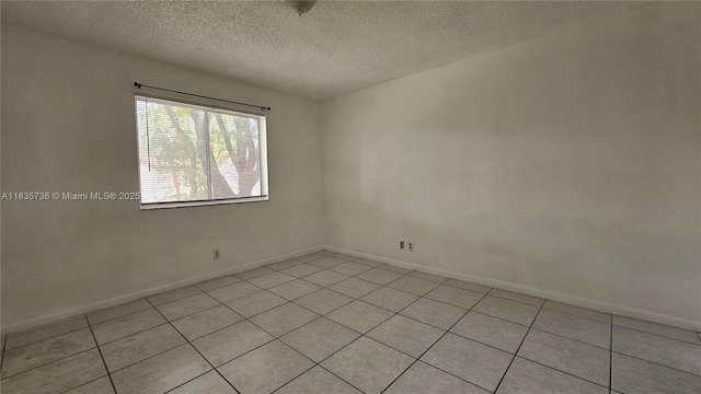 9277 SW 138th Pl Unit 9277, Miami, FL 33186 - unfurnished room featuring light tile patterned flooring and a textured ceiling