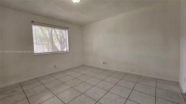 9277 SW 138th Pl Unit 9277, Miami, FL 33186 - spare room with light tile patterned floors and a textured ceiling