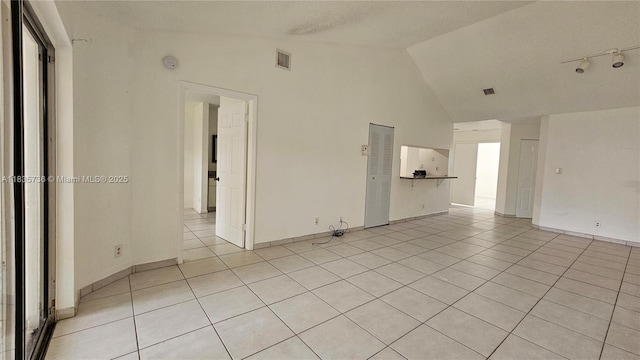 9277 SW 138th Pl Unit 9277, Miami, FL 33186 - unfurnished room with light tile patterned floors, high vaulted ceiling, and a smoke detector