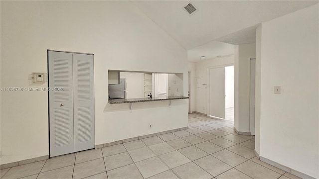 9277 SW 138th Pl Unit 9277, Miami, FL 33186 - unfurnished room with high vaulted ceiling and light tile patterned floors