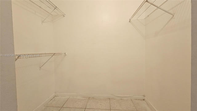 9277 SW 138th Pl Unit 9277, Miami, FL 33186 - walk in closet featuring light tile patterned floors