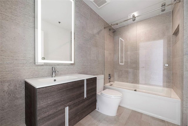 2681 N Flamingo Rd Unit 2708S, Sunrise, FL 33323 - bathroom featuring shower / washtub combination, vanity, and tile walls