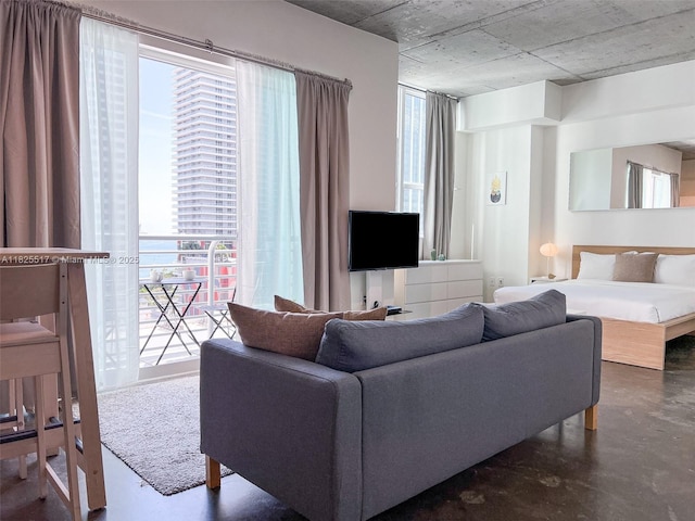 133 NE 2nd Ave Unit 1410, Miami, FL 33132 - living room featuring concrete flooring