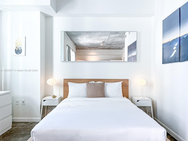 133 NE 2nd Ave Unit 1410, Miami, FL 33132 - bedroom featuring baseboards and concrete flooring