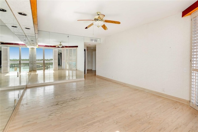3802 NE 207th St Unit 601, Aventura, FL 33180 - spare room featuring ceiling fan and wood finished floors