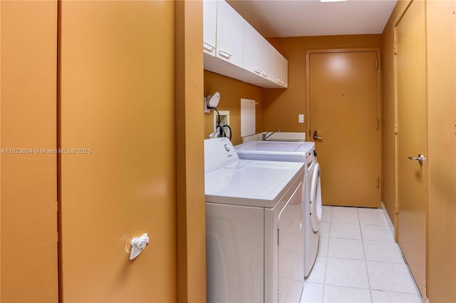 3802 NE 207th St Unit 601, Aventura, FL 33180 - laundry room with cabinet space, independent washer and dryer, and light tile patterned flooring