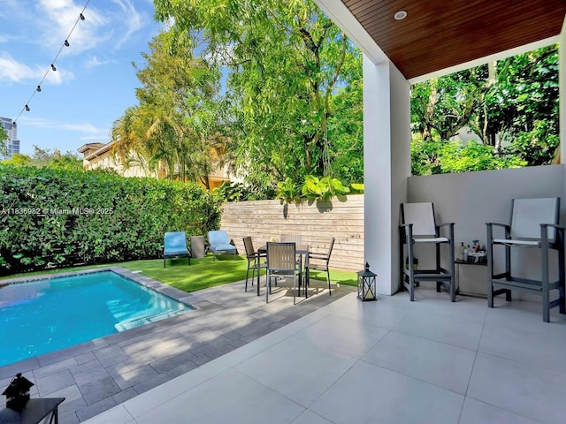 3070 Elizabeth St, Miami, FL 33133 - view of swimming pool featuring a patio area, a fenced backyard, and outdoor dining area