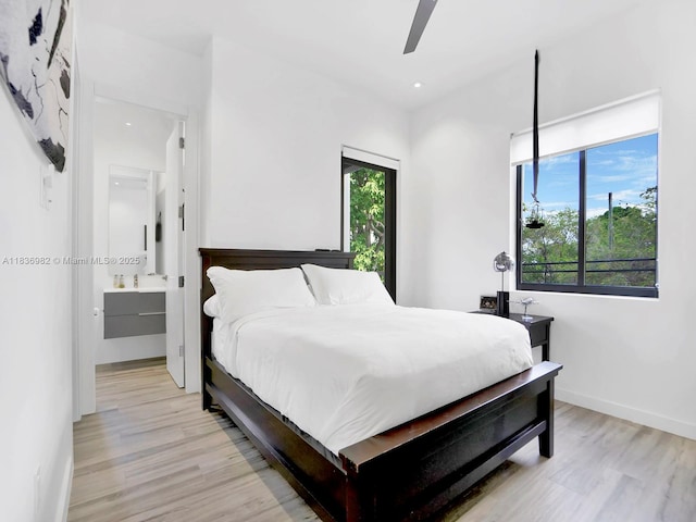 3070 Elizabeth St, Miami, FL 33133 - bedroom with light wood-type flooring, ensuite bathroom, and ceiling fan