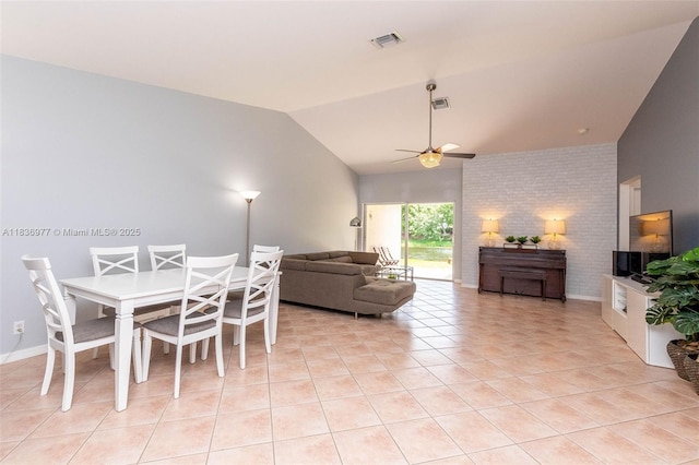 2020 Andromeda Ln, Weston, FL 33327 - dining space featuring lofted ceiling, a ceiling fan, light tile patterned floors, and brick wall