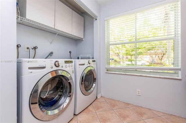 2020 Andromeda Ln, Weston, FL 33327 - laundry area with washer and dryer, cabinet space, and light tile patterned floors