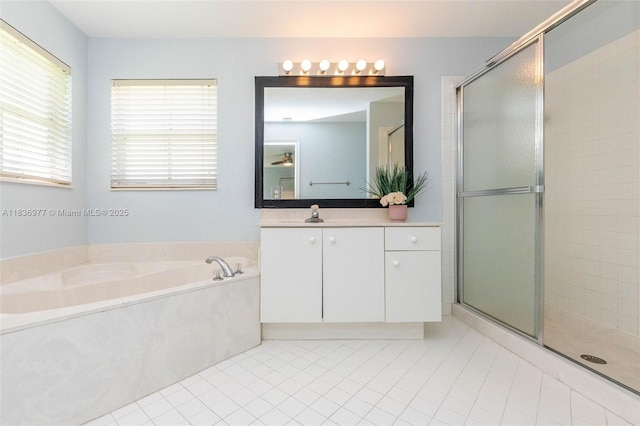 2020 Andromeda Ln, Weston, FL 33327 - bathroom with vanity, a stall shower, a bath, and tile patterned flooring
