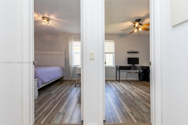 2020 Andromeda Ln, Weston, FL 33327 - bedroom with wood finished floors, a textured ceiling, and ceiling fan