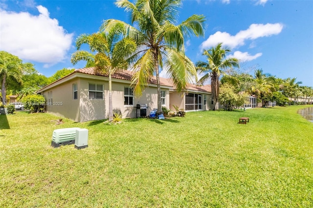 2020 Andromeda Ln, Weston, FL 33327 - back of property featuring stucco siding, a yard, and a tiled roof