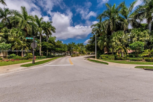 2020 Andromeda Ln, Weston, FL 33327 - view of asphalt street with sidewalks, street lights, curbs, and traffic signs