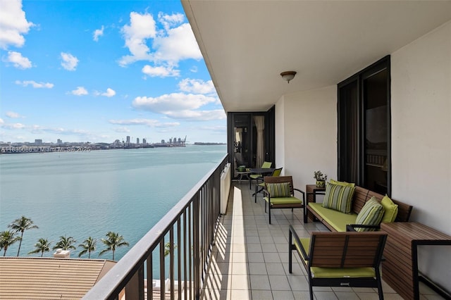 520 Brickell Key Dr Unit A1404, Miami, FL 33131 - balcony featuring a water view, outdoor lounge area, and a city view