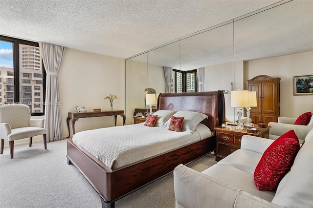 520 Brickell Key Dr Unit A1404, Miami, FL 33131 - carpeted bedroom featuring a wall of windows and a textured ceiling