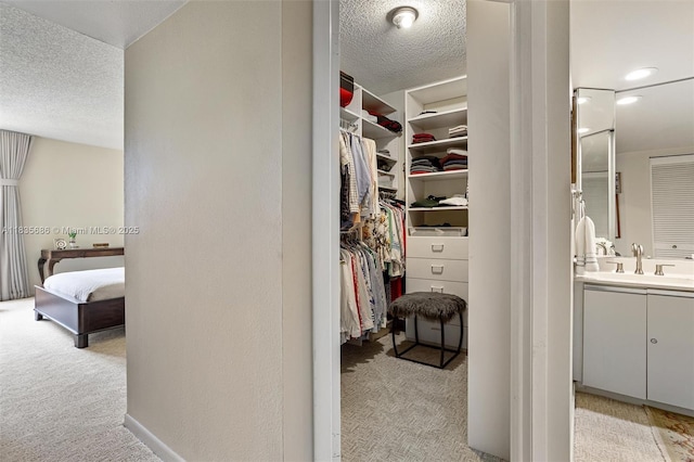 520 Brickell Key Dr Unit A1404, Miami, FL 33131 - walk in closet featuring light colored carpet