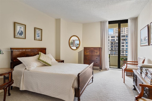 520 Brickell Key Dr Unit A1404, Miami, FL 33131 - carpeted bedroom with expansive windows, a textured ceiling, and access to outside