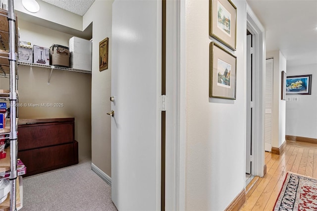 520 Brickell Key Dr Unit A1404, Miami, FL 33131 - hallway with baseboards and hardwood / wood-style floors