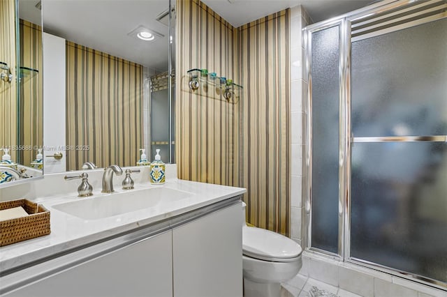 520 Brickell Key Dr Unit A1404, Miami, FL 33131 - full bath featuring tile patterned flooring, wallpapered walls, vanity, and a stall shower