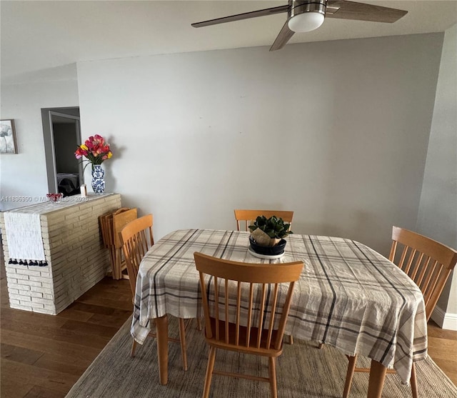 4621 NE 2nd Ave, Oakland Park, FL 33334 - dining area with a ceiling fan and wood finished floors