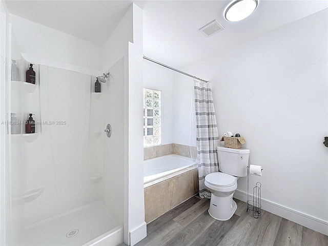 1309 SW 75th Ave, North Lauderdale, FL 33068 - bathroom with tiled bath, a shower with shower curtain, and wood finished floors