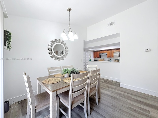 1309 SW 75th Ave, North Lauderdale, FL 33068 - dining space featuring a chandelier and light wood-style floors