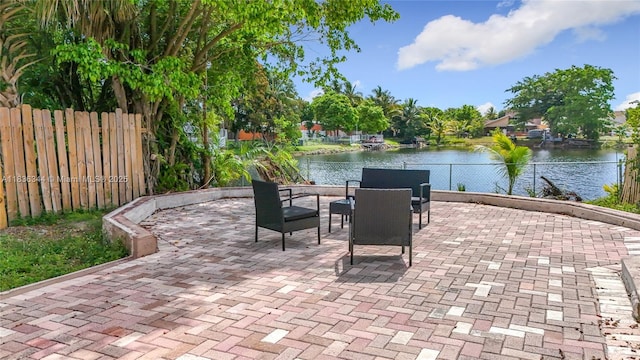 1309 SW 75th Ave, North Lauderdale, FL 33068 - fenced backyard with a water view and a patio